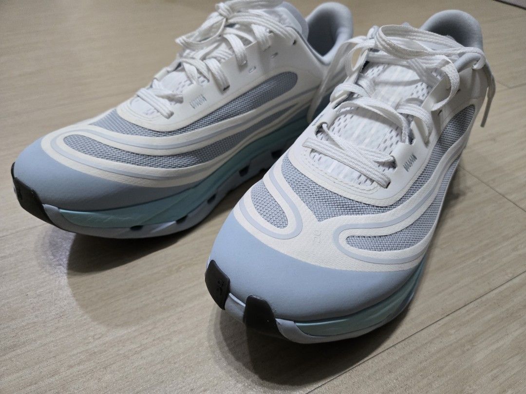 Rush!!! On Cloudflow 5 AD in Hail/White US 8 (Category: Sneakers) located in Manila. Submitted by acepgarcia1987 (Listing ID 1467856426, Image 2). Description: - Brand: On Cloudflow 5 AD in Hail/White, - Colorway: White and Light Blue - Size: US 8 / EU 41 / UK 7.5 / JP 26 - Condition: Clean overall with minimal wear - Features: Swiss engineering, breathable mesh upper, and signature CloudTec cushioning - Performance: Excellent daily trainer with 