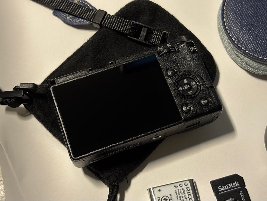 [RUSH] Ricoh GR IIIx + lens bundle (Category: Cameras) located in Manila. Submitted by yearielle19700 (Listing ID 1467969610, Image 2). Description: - Camera Model: Ricoh GR IIIx digital camera (fully working) - Condition: no issues no dents all buttons are working its good as new!! - battery, sd card, lens, strap included! - Storage: SanDisk microSD card with adapter included - battery, sd card, lens, strap are included Rfs: SELLING FOR RUSH i n