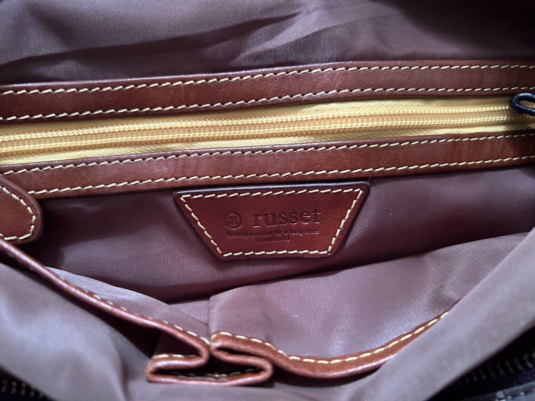 Russet Monogram Brown Tote Bag (Category: Tote Bags) located in Bambang. Submitted by mythriftstyle (Listing ID 1467905022, Image 2). Description: - Brown tote bag with all-over russet monogram print - Double shoulder straps for comfortable carrying - Top zip closure with magnetic snap buttons on the sides - Brown fabric-lined interior featuring a zippered pocket - Interior embossed leather brand logo patch - Elegant gold-toned hardware throughou