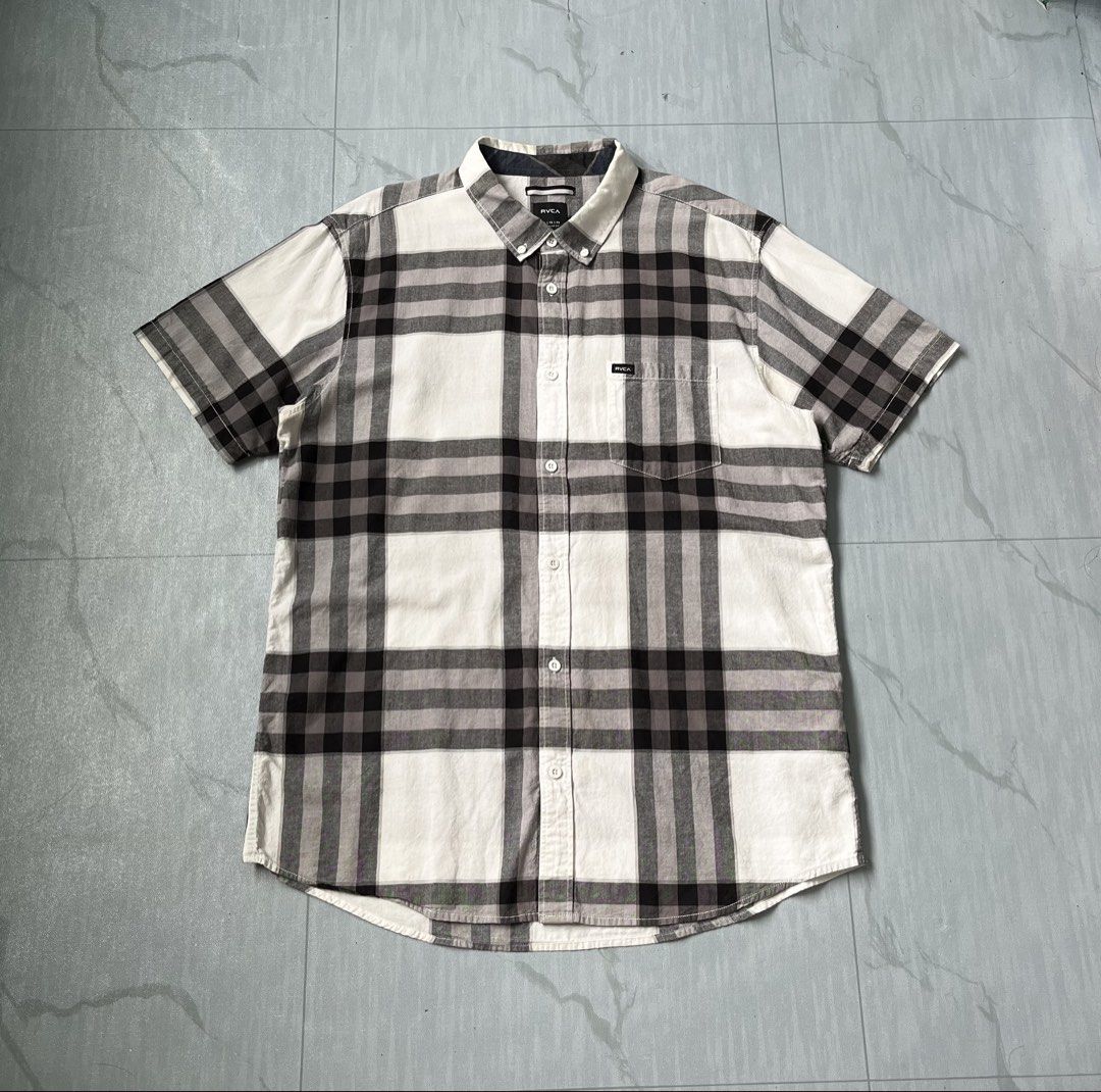 Rvca Plaid Short Sleeve Button Down Polo Shirt (Authentic) (Category: Tshirts & Polo Shirts ) located in Cavite. Submitted by newclassicwear (Listing ID 1467926529, Image 1). Description: Size XL On Tag (23width 29length) Excellent Condition None Any Issue 9.8 Honest Color Rate Can Do Meet Up Around Sm Tanza Cavite Tanza📍 RVCA plaid button-down shirt in black, white, and grey. Size XL regular fit with short sleeves and a chest pocket. Great soli