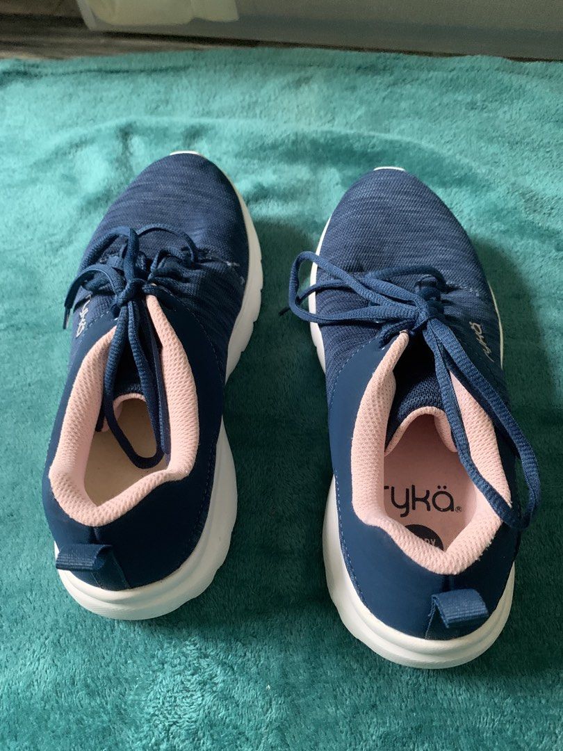 Ryka Navy Blue Pink Memory Foam Sneakers (Category: Sneakers) located in Bacoor. Submitted by goodfinds02 (Listing ID 1467932369, Image 2). Description: - Brand: Ryka - Color: Dark navy blue with soft pink lining and white soles - Comfort: Cushioned memory foam insoles for all-day support - Design: Lace-up closure with convenient heel pull tabs - Ideal for: Walking, workouts, and casual wear - Condition: Clean, lightweight, and ready to wear.
