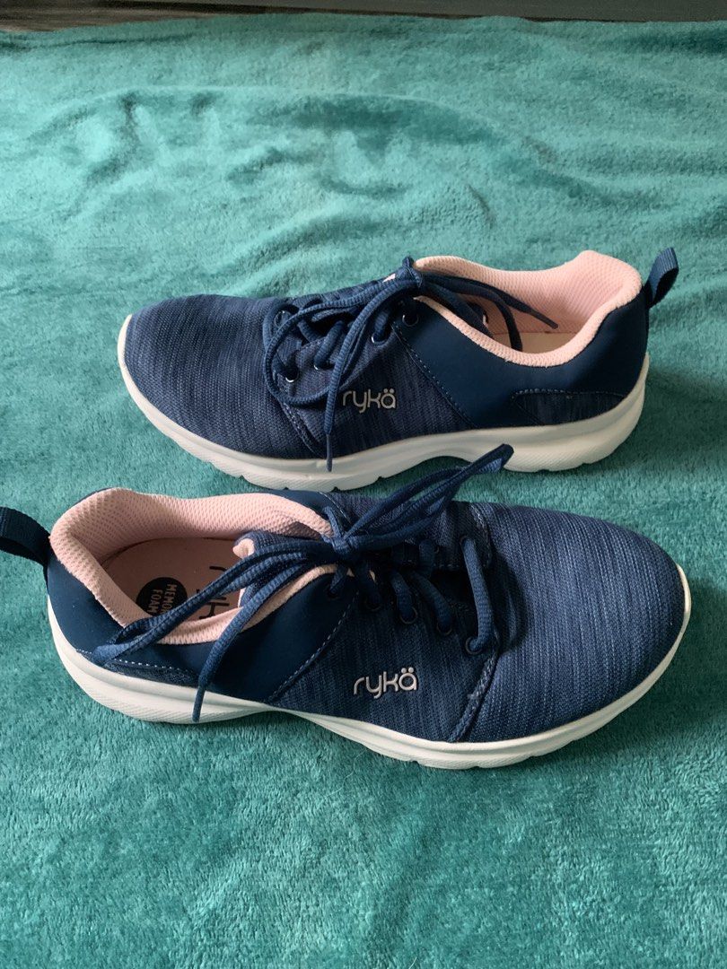 Ryka Navy Blue Pink Memory Foam Sneakers (Category: Sneakers) located in Bacoor. Submitted by goodfinds02 (Listing ID 1467932369, Image 3). Description: - Brand: Ryka - Color: Dark navy blue with soft pink lining and white soles - Comfort: Cushioned memory foam insoles for all-day support - Design: Lace-up closure with convenient heel pull tabs - Ideal for: Walking, workouts, and casual wear - Condition: Clean, lightweight, and ready to wear.