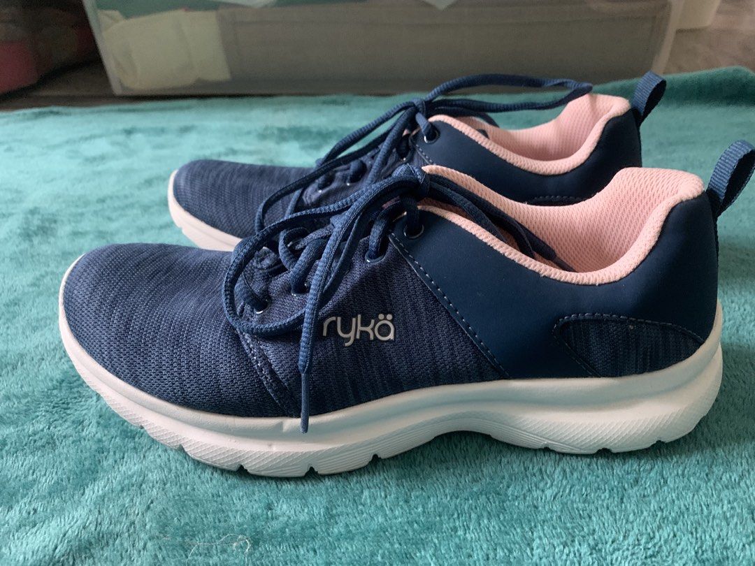 Ryka Navy Blue Pink Memory Foam Sneakers (Category: Sneakers) located in Bacoor. Submitted by goodfinds02 (Listing ID 1467932369, Image 1). Description: - Brand: Ryka - Color: Dark navy blue with soft pink lining and white soles - Comfort: Cushioned memory foam insoles for all-day support - Design: Lace-up closure with convenient heel pull tabs - Ideal for: Walking, workouts, and casual wear - Condition: Clean, lightweight, and ready to wear.