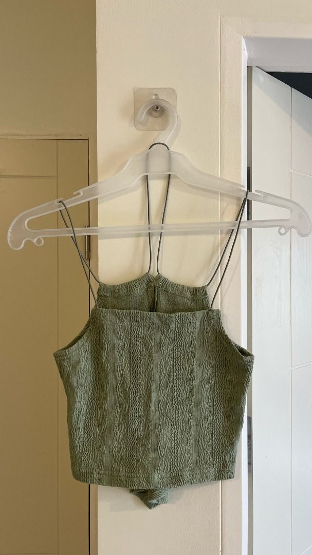 Sage Green Textured Halter Crop Top / S (Category: Sleeveless) located in Pasig City. Submitted by precipitation_ (Listing ID 1467863808, Image 2). Description: DETAILS • Brand: EIN - No Brand • Sage green color • Textured, crinkled fabric • Halter-style thin straps • Fitted, with a front keyhole cutout • Original price: ₩30,000 (bought in Hongdae, South Korea) • Worn only 2x PAYMENT GCash / BPI / BDO / MariBank 📦 Shipping via courier, shouldere
