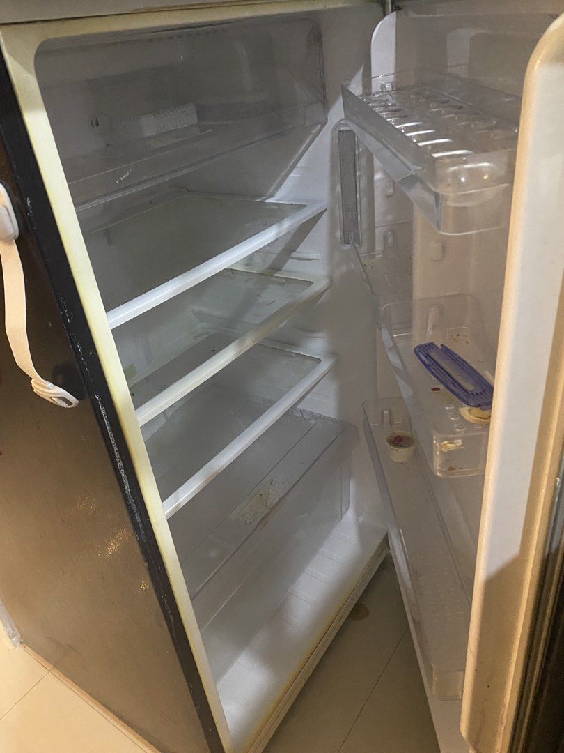 Samsung Double Door Refrigerator (Category: Refrigerators and Freezers) located in Paranaque City. Submitted by chescab_87 (Listing ID 1468057657, Image 3). Description: - Brand/Model: Samsung Two-Door Refrigerator (Black) - Layout: Top freezer compartment and bottom main fridge section - Storage: Multiple interior shelves and convenient door storage bins -Condition (for repair/ scrap mats). Motors broken..
