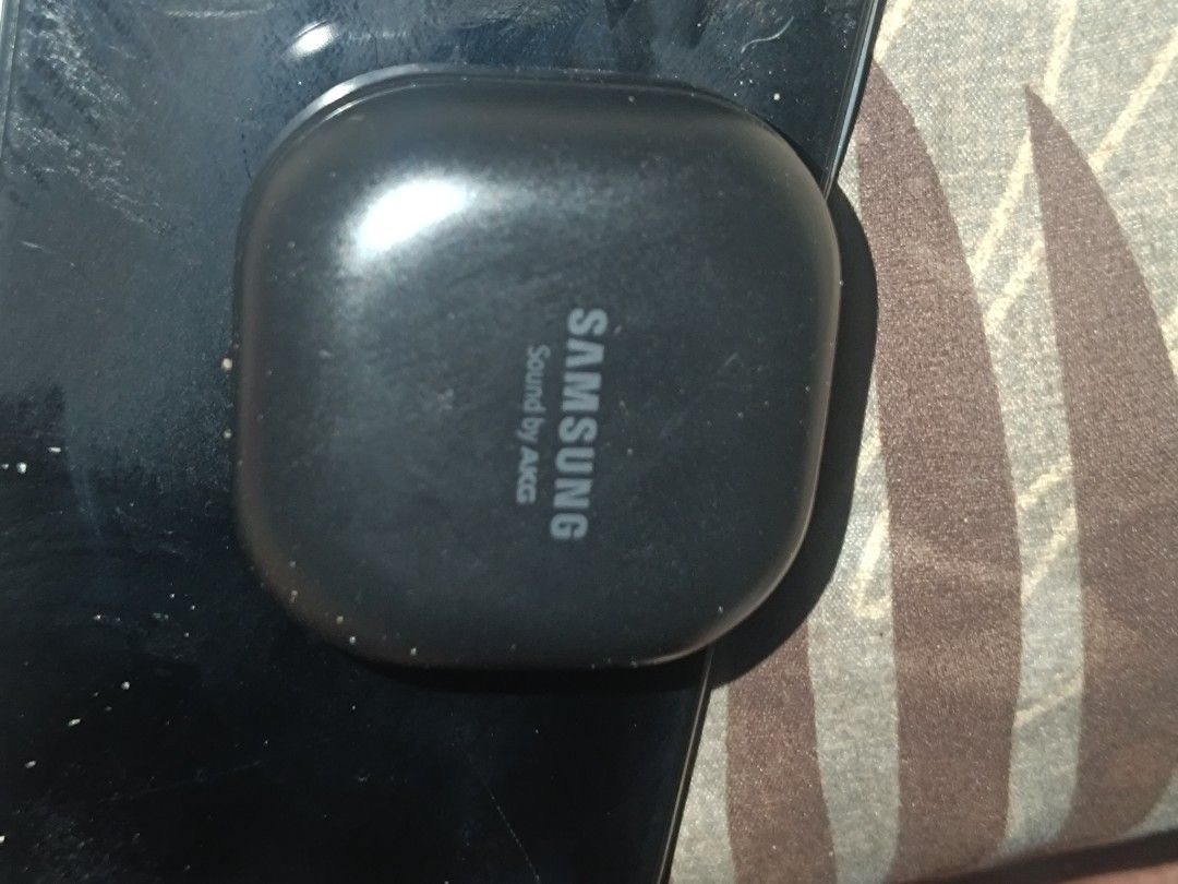 Samsung Galaxy Buds wireless charging case and earbuds (Category: Earphones) located in Manila. Submitted by mysticdolphin.99513a (Listing ID 1468029426, Image 1). Description: - Brand: Samsung with AKG sound tuning - Color: Black - Condition: Sound works great and charges normally - Design: Compact, pocket-friendly square charging case with red status LED - Connectivity: Simple Bluetooth pairing with Android and compatible devices - Ideal for: D