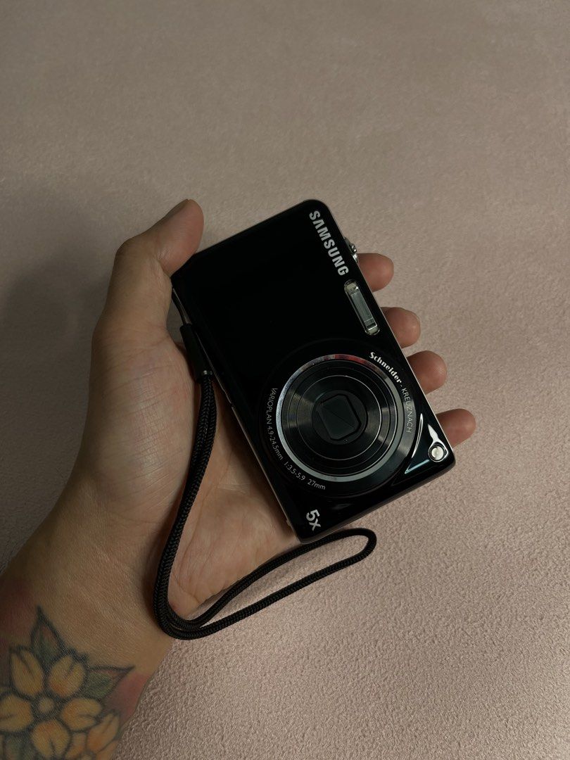 Samsung ST600 Digital Camera with Lowepro Case (Category: Cameras) located in Imus. Submitted by graeyowl (Listing ID 1467935036, Image 1). Description: - Model: Samsung ST600 Digital Camera (Black) - Lens: Schneider-Kreuznach with 5x optical zoom - Display: Dual screen with front LCD for easy self-portraits - Included Accessories: Black Lowepro zippered case and wrist strap - Condition: Powers on via top button, fully functional for daily carry 