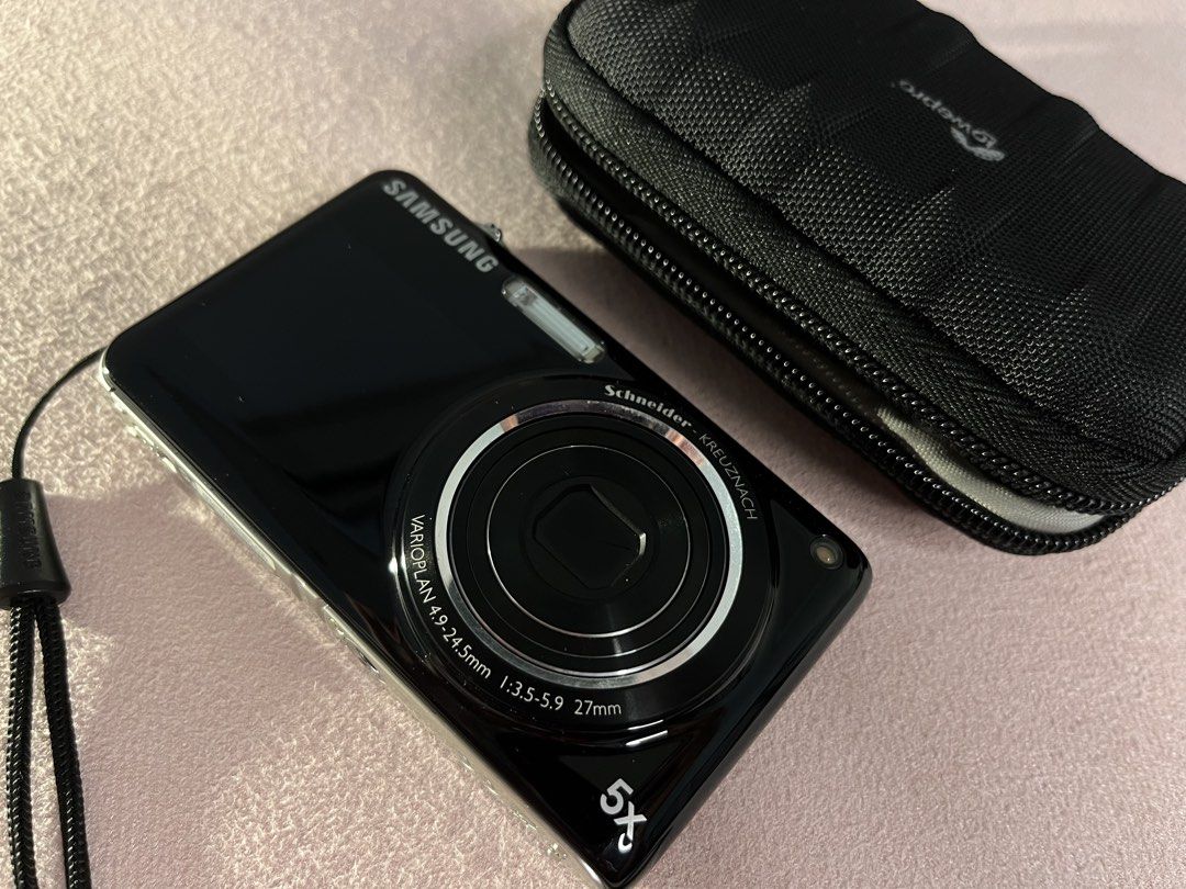 Samsung ST600 Digital Camera with Lowepro Case (Category: Cameras) located in Imus. Submitted by graeyowl (Listing ID 1467935036, Image 2). Description: - Model: Samsung ST600 Digital Camera (Black) - Lens: Schneider-Kreuznach with 5x optical zoom - Display: Dual screen with front LCD for easy self-portraits - Included Accessories: Black Lowepro zippered case and wrist strap - Condition: Powers on via top button, fully functional for daily carry 