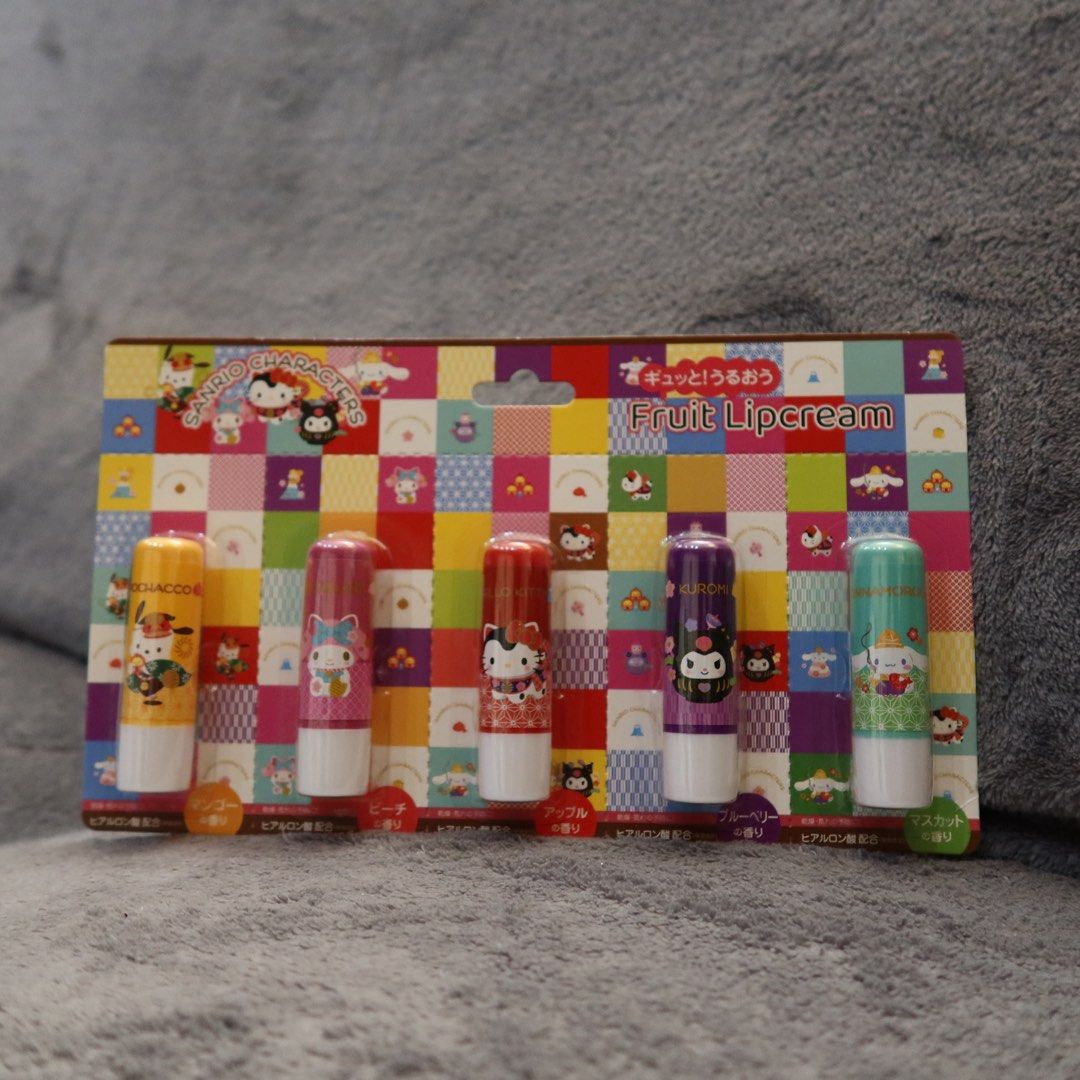 Sanrio Characters Fruit Lipcream Set 5 Pieces (Category: Makeup) located in Manila. Submitted by gentlewind_62f064 (Listing ID 1467925728, Image 2). Description: - Set of 5 adorable Sanrio fruit-scented lip balms - Includes 5 lovable characters and fruity scents: * Pochacco (Mango) * My Melody (Peach) * Kitty (Apple) * Kuromi (Blueberry) * Cinnamoroll (Muscat) - Brand new, unused, and sealed on the original colorful checkered backing card - Great