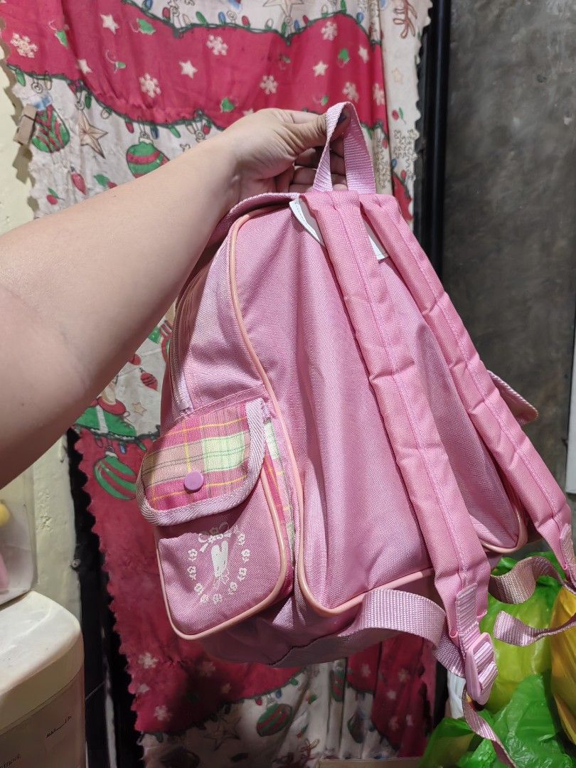 Sanrio Marron Cream Pink Plaid Backpack (Category: Backpacks) located in Manila. Submitted by zaekim1380 (Listing ID 1467910754, Image 2). Description: - Authentic vintage Sanrio Marron Cream backpack from 1985/1998 - Adorable pink plaid design with front pocket character graphics - Secure flap closure with buckle snap - Convenient side pockets and adjustable shoulder straps - Great size for school, daily use, or Sanrio collectors.