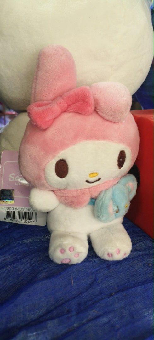 Sanrio My Melody Plush Toy (Category: Plushies & Soft Toys) located in Manila. Submitted by greatteachermav14 (Listing ID 1467875029, Image 1). Description: - Authentic Sanrio My Melody plush toy - Features signature pink hood and matching bow - Holding a cute small blue plush accessory - Detailed with pink paw pads on the feet - Perfect for gifts and collectors.