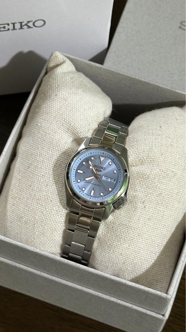 Seiko 5 SRRA001 Automatic Ice Blue Dial Watch (Category: Women's Watches) located in Quezon City. Submitted by gktan003602644 (Listing ID 1467875681, Image 2). Description: - Model: Seiko 5 Sports SRRA001 - Dial: Stunning ice blue with rose gold-tone hands and hour markers - Bracelet: Silver steel - Features: Date display at 3 o'clock, 21 jewels automatic movement - Condition: Brand new - Inclusions: Original white outer box and inner presentatio