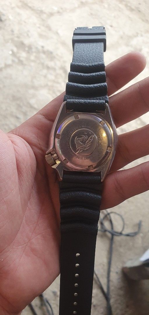 Seiko slim turtle Automatic Diver 150m Watch Black Dial (Category: Men's Watches) located in Zamboanga. Submitted by sarahjaneatari (Listing ID 1467903857, Image 2). Description: - Vintage Seiko automatic diver watch - Black dial with 3 o'clock day-date window - Rotating bezel with clear markings - Ribbed black rubber strap with buckle closure - Stainless steel case back with iconic tsunami wave engraving - Automatic movement (runs on wrist motio