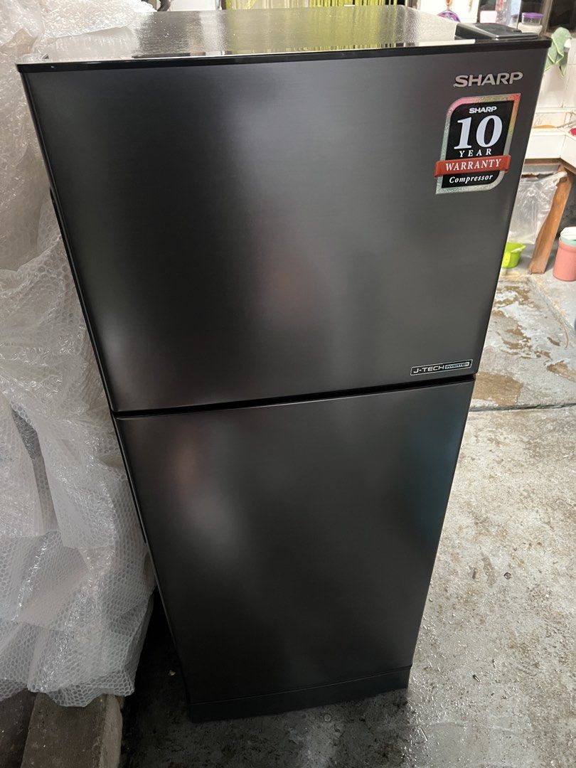 Sharp J-Tech Inverter Double Door Refrigerator (Category: Refrigerators and Freezers) located in Rizal. Submitted by jirummm (Listing ID 1467894044, Image 1). Description: - Brand: Sharp J-Tech Inverter - Color: Sleek Black - Type: Two-door (Top freezer / Bottom fridge) - Features: Clear glass shelves and durable door bins -In very good condition -bought for 18k .