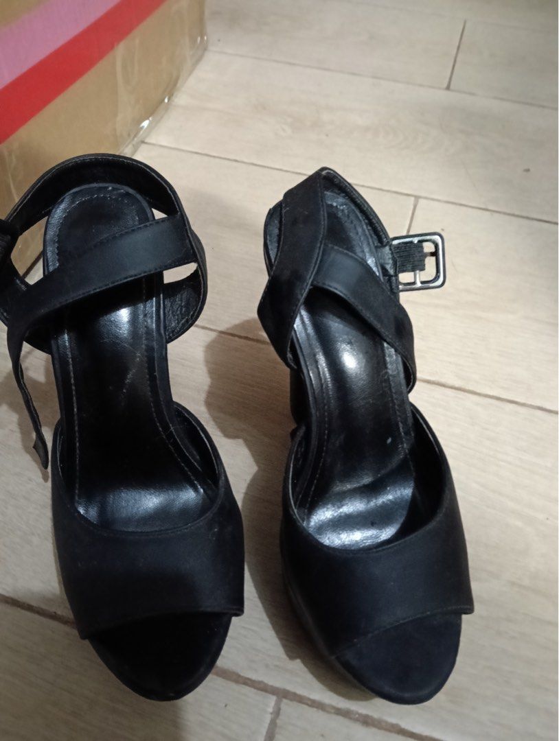 Shein Black High Heel Sandals with Ankle Strap (Category: Heels) located in Manila. Submitted by goddesssy (Listing ID 1467840983, Image 1). Description: - Color: Black - Material: Satin-like finish - Style: Open toe high heel sandals with platform soles - Heel: Sturdy block heel for added height and comfort - Closure: Adjustable buckle ankle strap - Occasion: Ideal for evening outings or formal events - Condition: Minor wear visible on the inner