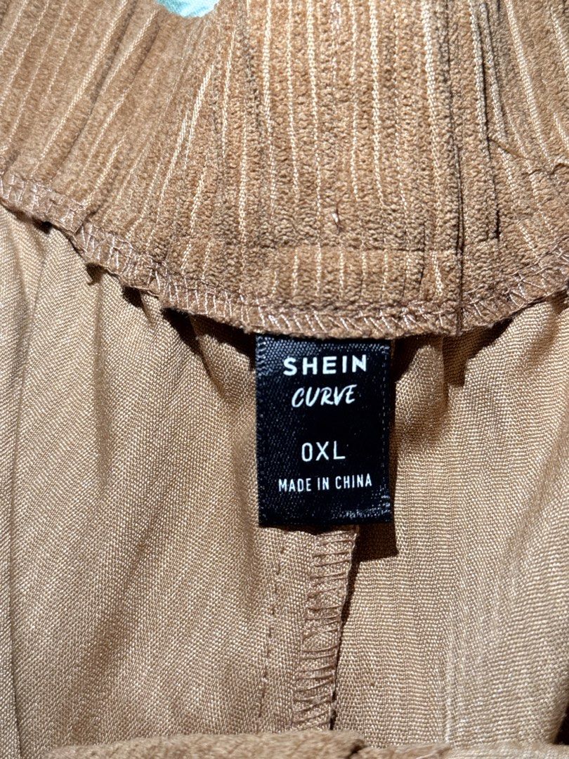 SHEIN Curve Corduroy Pants (Category: Jeans) located in San Miguel. Submitted by matchalatte23_ (Listing ID 1467990118, Image 3). Description: COLOR: Brown, White, Black 390 EACH - Brand: SHEIN Curve - Style: High waist corduroy pants with pleated front - Waist: Elastic back waistband for extra comfort - Details: Button closure and trendy roll-up cuffs - Fabric: Soft and cozy ribbed material - Condition: Brand new - Perfect for: Casual everyday o