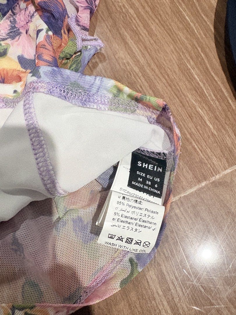 SHEIN Floral Mesh Crop Top Size M (Category: Sleeveless) located in Manila. Submitted by thriftwithgem (Listing ID 1467899806, Image 2). Description: - Brand: SHEIN - Style: Mesh crop top with colorful floral pattern - Details: Front boning, scoop neckline, and short sleeves - Size: Medium (EU 38, US 6) - USED TWICE.