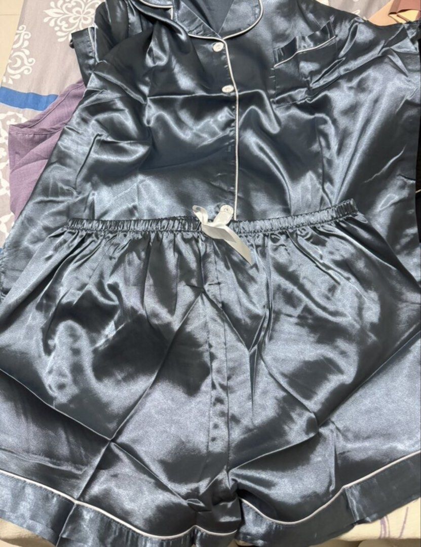 Shein Satin Pajama Set Shorts Coords (Category: Undergarments & Loungewear) located in Baras. Submitted by vale831 (Listing ID 1468024576, Image 1). Description: - Set includes: Short-sleeve button-down top with pocket and matching shorts - Waistband: Comfortable elastic with a cute white ribbon tie - Material: Soft, silky satin for ultimate comfort - Condition: Clean and ready to wear - Ideal for: Sleeping or relaxing at home.