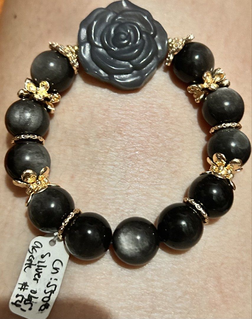 Silver Obsidian and Agate Rose Charm Bracelet (Category: Bracelets) located in Marikina City. Submitted by tresariascats (Listing ID 1467914627, Image 1). Description: - Handmade beaded bracelet with genuine silver obsidian round beads - Features a beautiful carved black rose center stone - Accented with elegant gold-toned flower spacers and textured rings - Built with durable elastic stretch cord for easy slip-on wear - Lightweight and comfortab