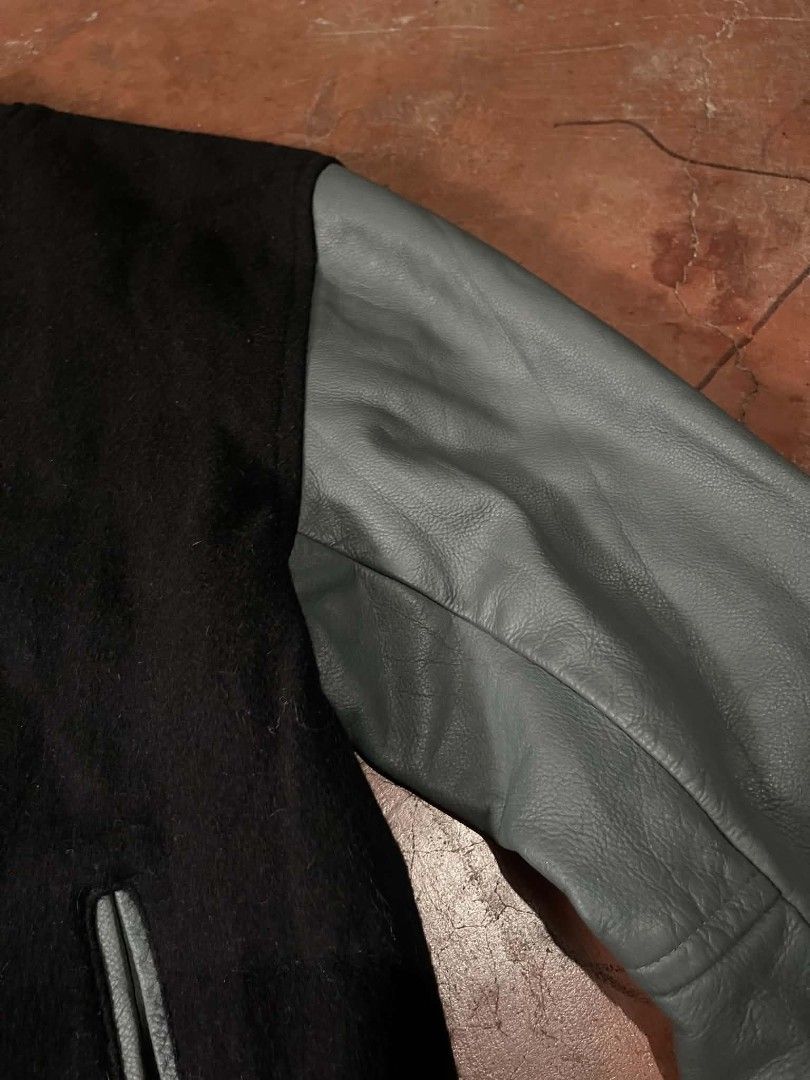 Sledwise Black Wool and Grey Leather Varsity Jacket (Category: Coats, Jackets and Outerwear) located in Gumaca. Submitted by makuliti (Listing ID 1467956905, Image 3). Description: - Brand: Sledwise - Style: Classic letterman / varsity jacket - Material: Black wool body with premium grey leather sleeves - Closure: Front snap buttons - Pockets: Matching front welt pockets - Details: Ribbed collar, cuffs, and hem with grey stripe accents - Construc