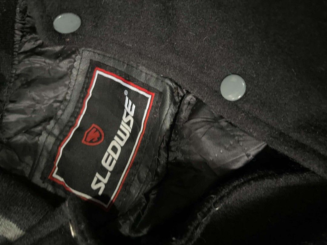 Sledwise Black Wool and Grey Leather Varsity Jacket (Category: Coats, Jackets and Outerwear) located in Gumaca. Submitted by makuliti (Listing ID 1467956905, Image 2). Description: - Brand: Sledwise - Style: Classic letterman / varsity jacket - Material: Black wool body with premium grey leather sleeves - Closure: Front snap buttons - Pockets: Matching front welt pockets - Details: Ribbed collar, cuffs, and hem with grey stripe accents - Construc
