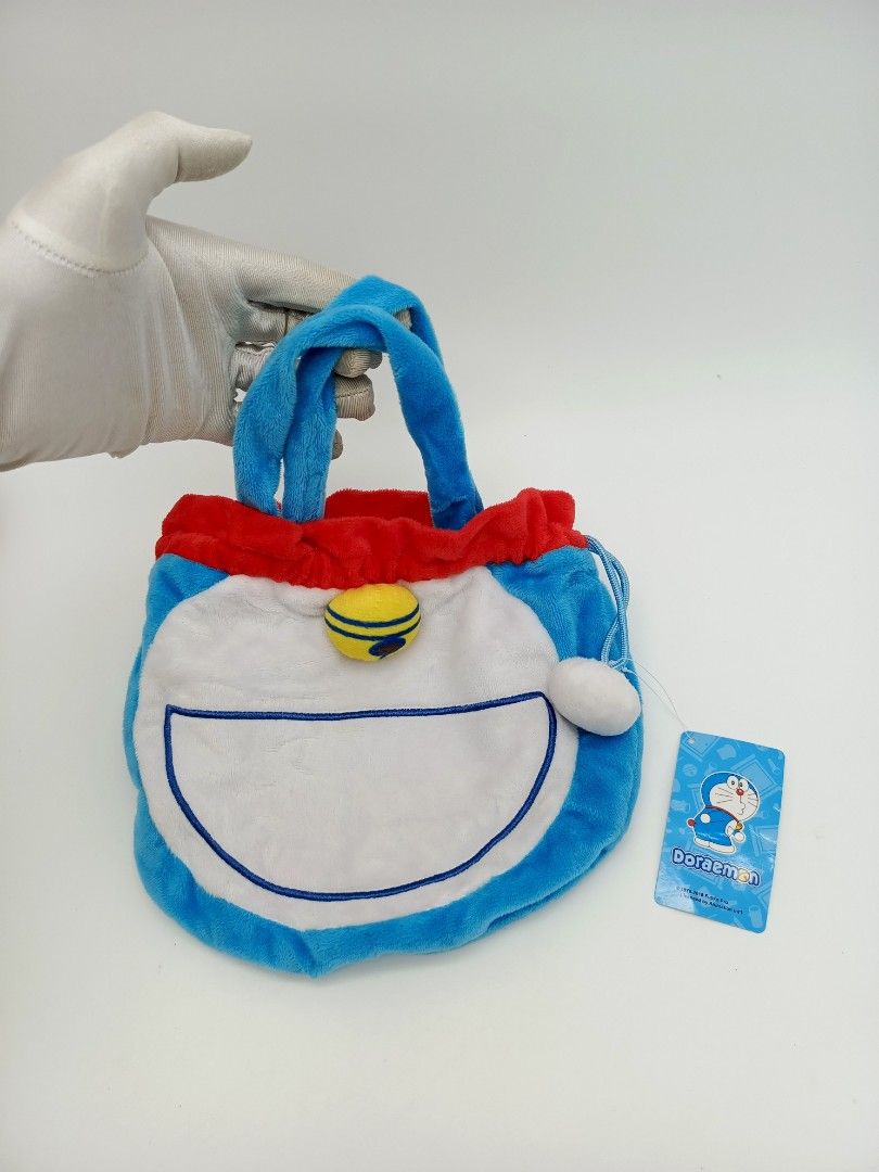 Small Doraemon Drawstring Handbag (Category: Purses & Pouches) located in Santa Cruz. Submitted by g-stuff21 (Listing ID 1467866765, Image 1). Description: Small size handbag, can fit small items only like coins, charger, cards etc. 2 Pieces available. Feel free to pm for more info..