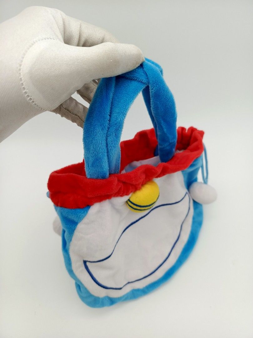 Small Doraemon Drawstring Handbag (Category: Purses & Pouches) located in Santa Cruz. Submitted by g-stuff21 (Listing ID 1467866765, Image 2). Description: Small size handbag, can fit small items only like coins, charger, cards etc. 2 Pieces available. Feel free to pm for more info..