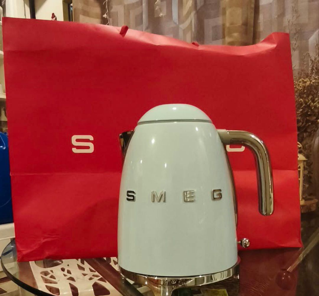 Smeg Pastel Blue Kettle (Category: Kettles & Airpots) located in Manila. Submitted by honey.bee.shop (Listing ID 1467947377, Image 1). Description: - Brand: Smeg Electric Kettle - Color: Pastel Blue - Design: Iconic retro look with chrome base, handle, and raised chrome lettering - Condition: Great kitchen countertop appliance, stylish addition to any setup - Details: Plug and cord included - Mode of Payment: GCash, BPI, or Bank Transfer - Shippi