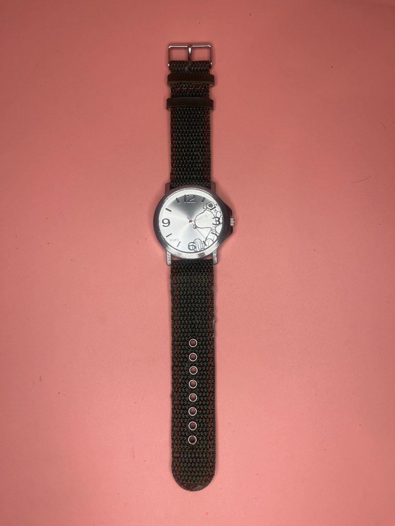 Snoopy Peanuts Analog Wristwatch with Canvas Strap (Category: Women's Watches) located in Caloocan City. Submitted by snapshop_ph (Listing ID 1468055472, Image 1). Description: - Authentic Peanuts Snoopy wristwatch with silver-tone dial (features numbers 3, 9, 12) - Dark canvas outer strap with contrast red stitching and metal buckle - Note: Beige inner lining shows significant cracking and wear - Powered by reliable SII Movement, 3 ATM water res