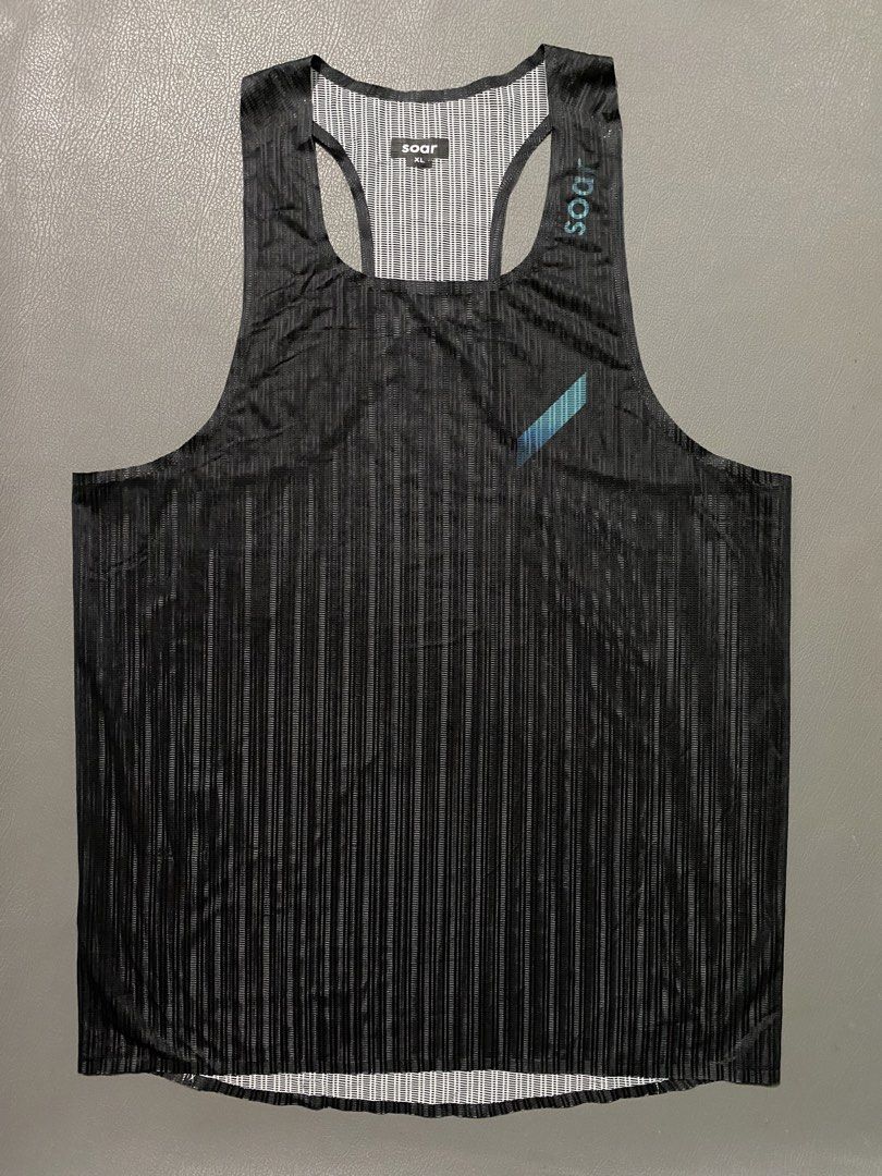 Soar Running Singlet Black Men XL (Category: Activewear) located in Pozorrubio. Submitted by izaykite2g (Listing ID 1467991955, Image 1). Description: Soar mens race vest XL on tag 19.5 × 29 Excellent condition - Item: Running Singlet - Color: Black with subtle teal branding - Size: XL - Fabric: Lightweight striped mesh for high breathability - Design: Racerback cut for full range of motion - Ideal for: Marathon training and hot weather workouts.
