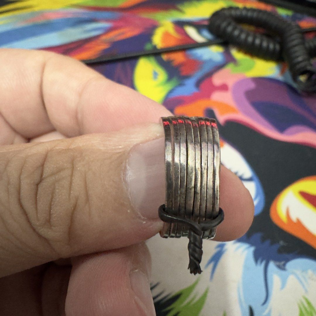 Solid 925 Sterling Silver Puzzle Ring (8 pcs) (Category: Jewelry) located in Quezon City. Submitted by rueldg214 (Listing ID 1467962853, Image 3). Description: - Material: Genuine sterling silver with stamped 925 hallmark (Uni Silver) - Design: Classic interlocking multi-band puzzle style - Condition: Pre-loved with minor surface tarnishing and visible signs of wear - Style: Great everyday accessory or unique conversation piece.