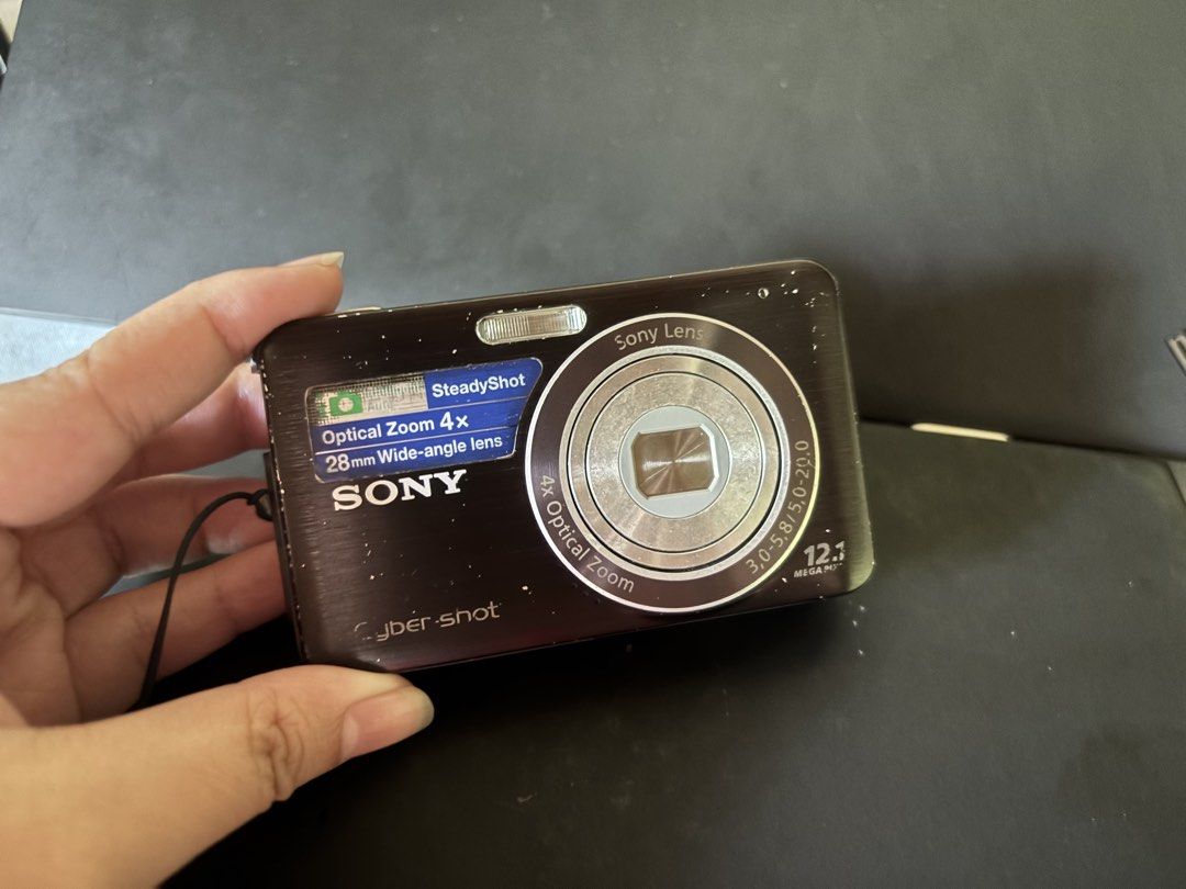 Sony Cybershot DSC-W310 (Category: Cameras) located in Calamba. Submitted by defuranna (Listing ID 1467906811, Image 1). Description: - Model: Sony Cyber-shot DSC W310 (Black) - Features: SteadyShot image stabilization - Condition: Powers on and functions normally, battery/memory card door intact - Portability: Compact point-and-shoot, pocket-friendly with wrist strap attached - Has visible signs of usage on its cosmetics. Not affecting output. -