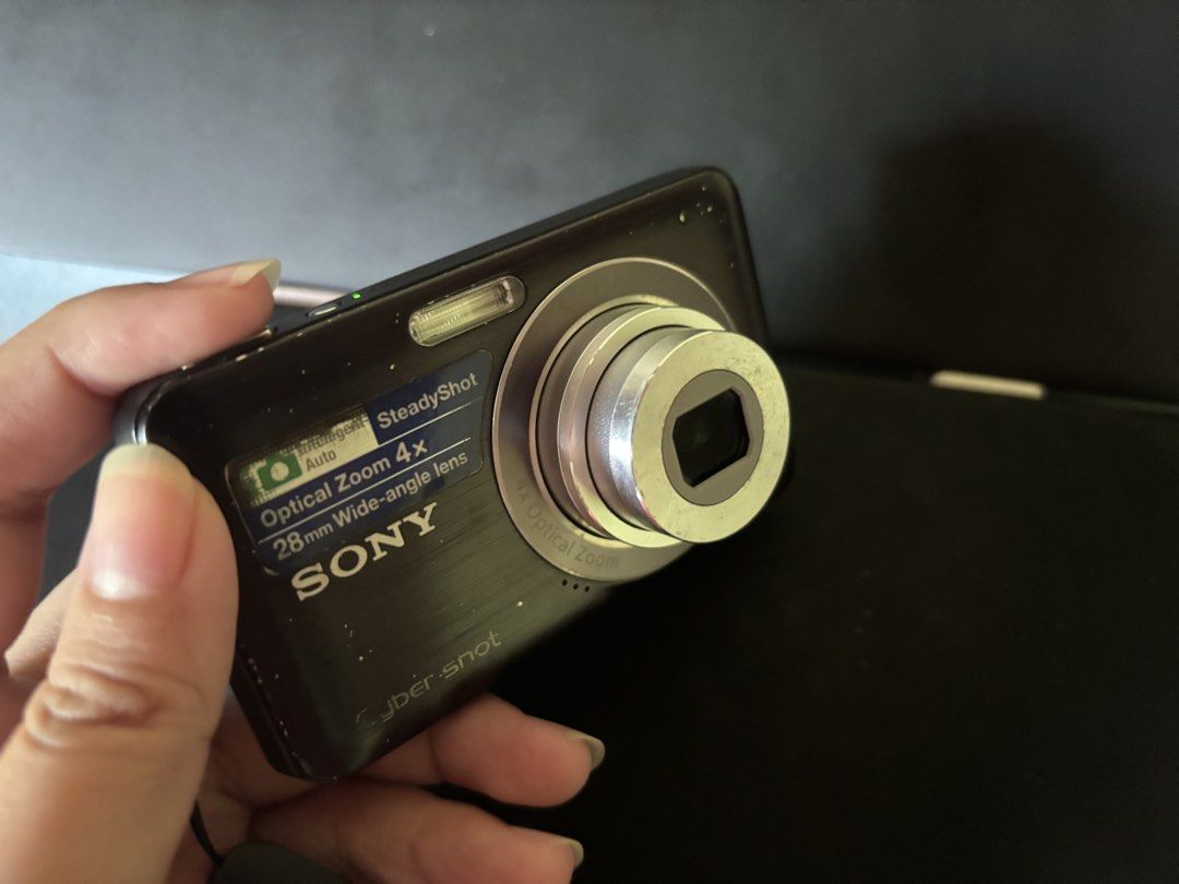 Sony Cybershot DSC-W310 (Category: Cameras) located in Calamba. Submitted by defuranna (Listing ID 1467906811, Image 2). Description: - Model: Sony Cyber-shot DSC W310 (Black) - Features: SteadyShot image stabilization - Condition: Powers on and functions normally, battery/memory card door intact - Portability: Compact point-and-shoot, pocket-friendly with wrist strap attached - Has visible signs of usage on its cosmetics. Not affecting output. -