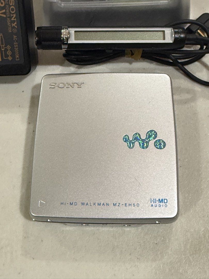 Sony Hi-MD Walkman MZ-EH50 Minidisc (Category: Portable Music Players) located in Makati City. Submitted by see5o5 (Listing ID 1467862649, Image 2). Description: Sony Hi-MD Walkman MZ-EH50 Plays Hi-MD, Hi-MD formatted minidiscs and regular minidiscs. All working well. There are just some small scratches from regular use and cord repair on the charger. Unit,battery, power adapter, and remote control (MC38EL) The Hi-MD disc is not included but I wi