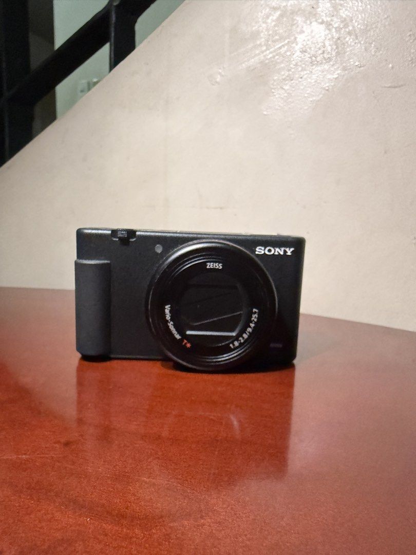 Sony Zv-1 Camera (Category: Cameras) located in Quezon City. Submitted by tanyasy_52 (Listing ID 1467943300, Image 2). Description: 📸 FOR SALE: Sony ZV-1 Camera 💰 ₱26,000 (Negotiable) ✨ Super good condition, almost like new! ✨ Rarely used and well-maintained ✨ Perfect for photography, vlogging, and content creation! Inclusions: * Original box * USB cable * Wind muff (deadcat) * pouch * Phone adapters * FREE Ulanzi Light! 💡 📩 Message me if int
