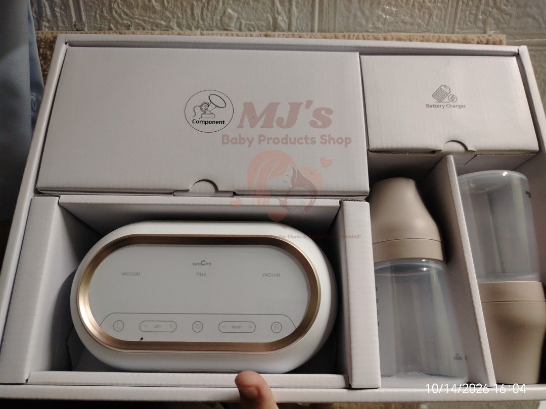 Spectra Dual Compact Electric Breast Pump (Category: Breastfeeding & Bottle Feeding) located in Pulilan. Submitted by mjbabyproductsshop (Listing ID 1467912202, Image 2). Description: - Authentic Spectra dual compact electric breast pump (White & Rose Gold) - Includes main pump body, rechargeable battery charger, component box, and bottles with nipples - Dual independent motors with customizable settings for each side - Built-in back-flow protect