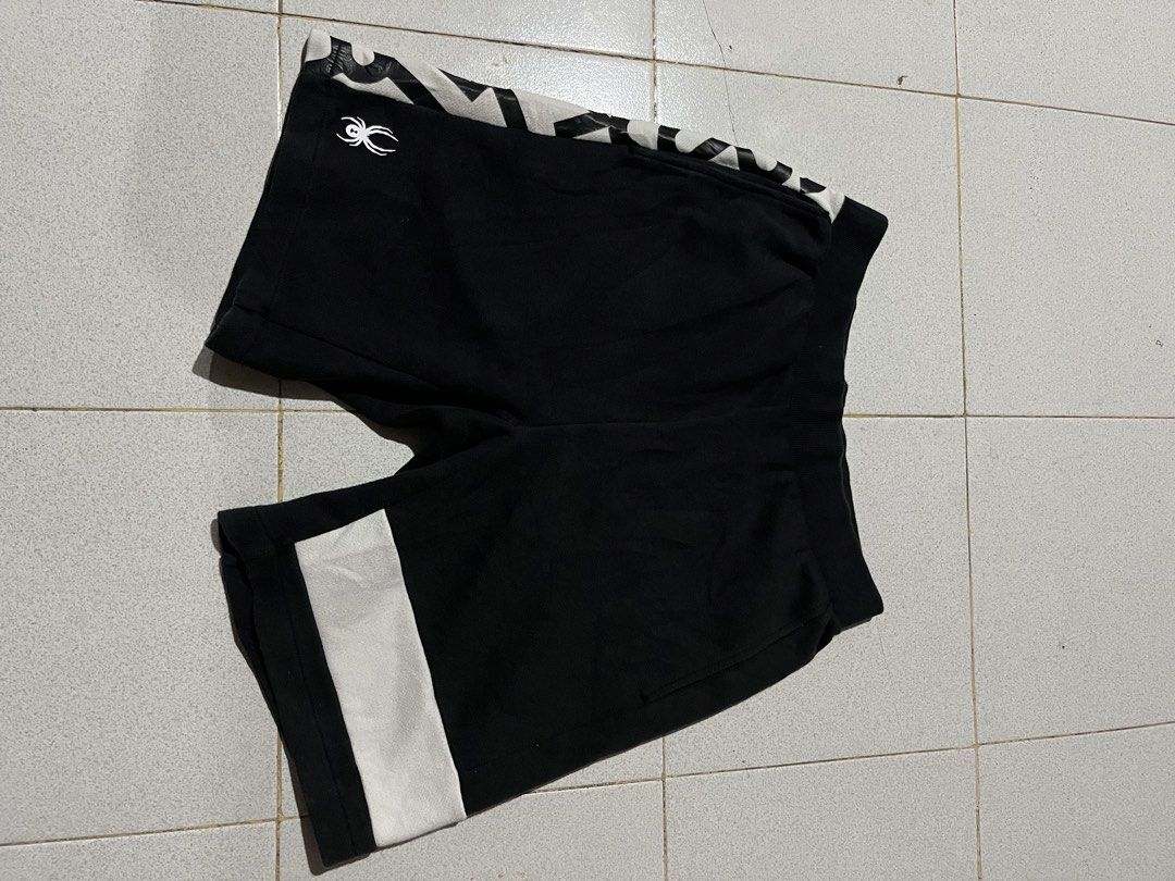 Spyder Black and White Athletic Shorts (Category: Shorts) located in Manila. Submitted by matik6 (Listing ID 1468020173, Image 1). Description: Spyder athletic shorts in black with white and black graphic print panels. Elastic waistband with ribbed texture. Small spider logo on the front lower leg and brand lettering on the back pocket. Soft cotton fabric, great for workouts or casual wear..