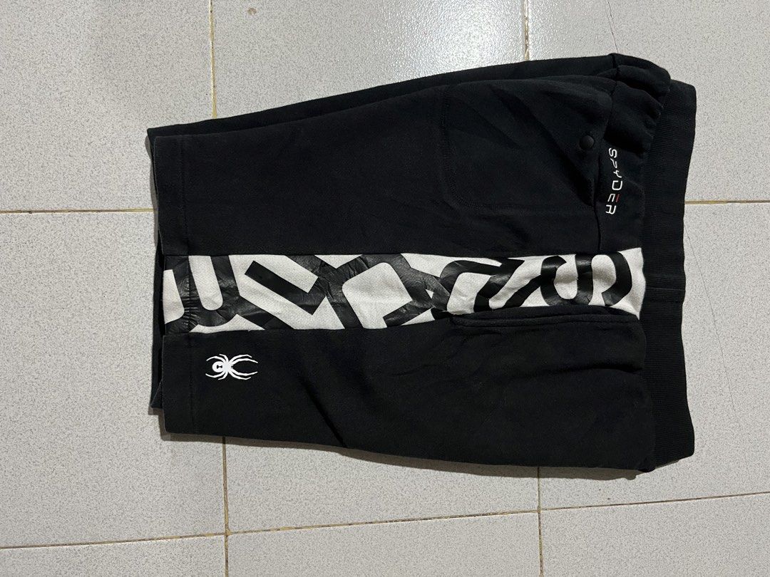 Spyder Black and White Athletic Shorts (Category: Shorts) located in Manila. Submitted by matik6 (Listing ID 1468020173, Image 3). Description: Spyder athletic shorts in black with white and black graphic print panels. Elastic waistband with ribbed texture. Small spider logo on the front lower leg and brand lettering on the back pocket. Soft cotton fabric, great for workouts or casual wear..