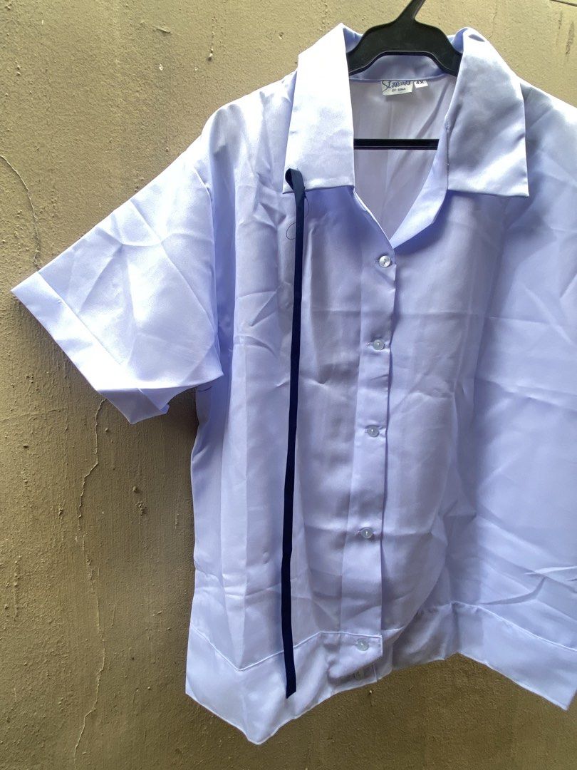 St Marks by Gina white uniform blouse size 4X (Category: Blouses) located in Muntinlupa City. Submitted by 4eva3volve (Listing ID 1467947729, Image 2). Description: - Brand: St Marks by Gina - Size: 4X - Color: White - Style: Short sleeve, collared neckline, front button closure - Special Detail: Built-in dark ribbon accent down the front (can be removed) - Condition: Clean fabric with tag attached at inner collar, ready to wears - Ideal For: Sch