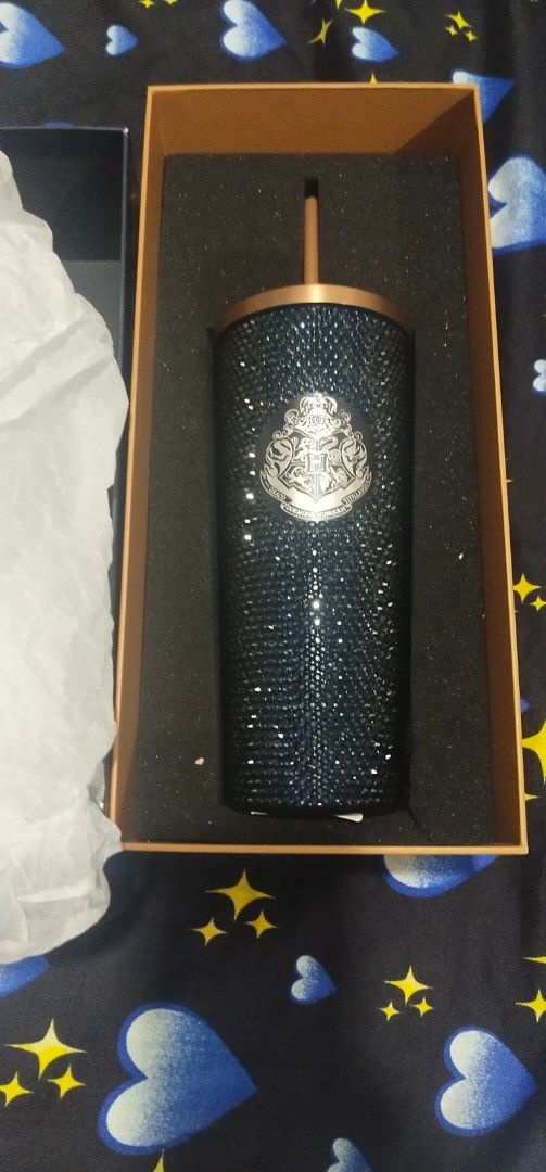 Starbucks Harry Potter Rhinestone Cold Cup (Category: Water Bottles & Tumblers) located in Muntinlupa City. Submitted by grayfox05 (Listing ID 1467963947, Image 3). Description: - Official Starbucks x Harry Potter collaboration cold cup - Stunning dark blue rhinestone design covered in sparkly crystals - Features the iconic Starbucks Siren logo on one side and Hogwarts crest on the other - Comes with a matching dark blue straw - Brand new, 100% a