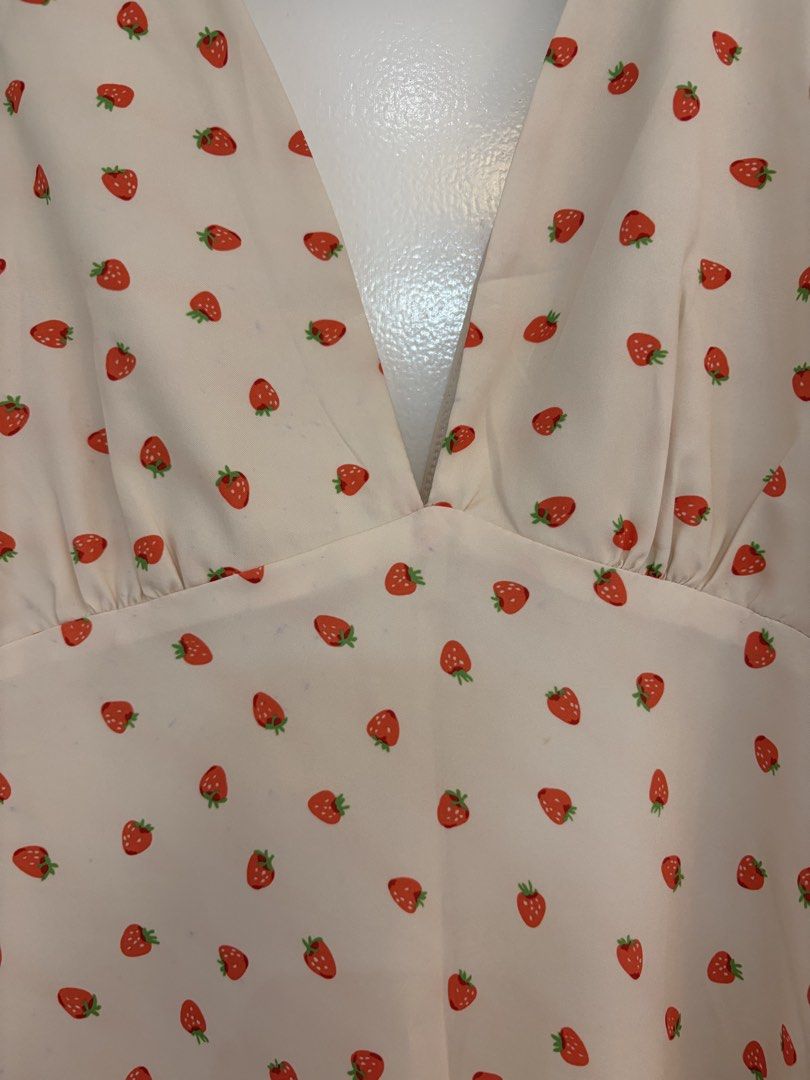 Strawberry Sleeveless Mini Dress (Category: Dresses) located in Quezon City. Submitted by prelovedbynxkole (Listing ID 1467880347, Image 2). Description: - Super cute cream mini dress with an adorable all-over red strawberry print - Features a flattering deep v-neckline and sleeveless cut - Flared skater skirt bottom with a gathered waistline just under the bust - Versatile summer piece that is very easy to dress up or down - Minor stains, see ph