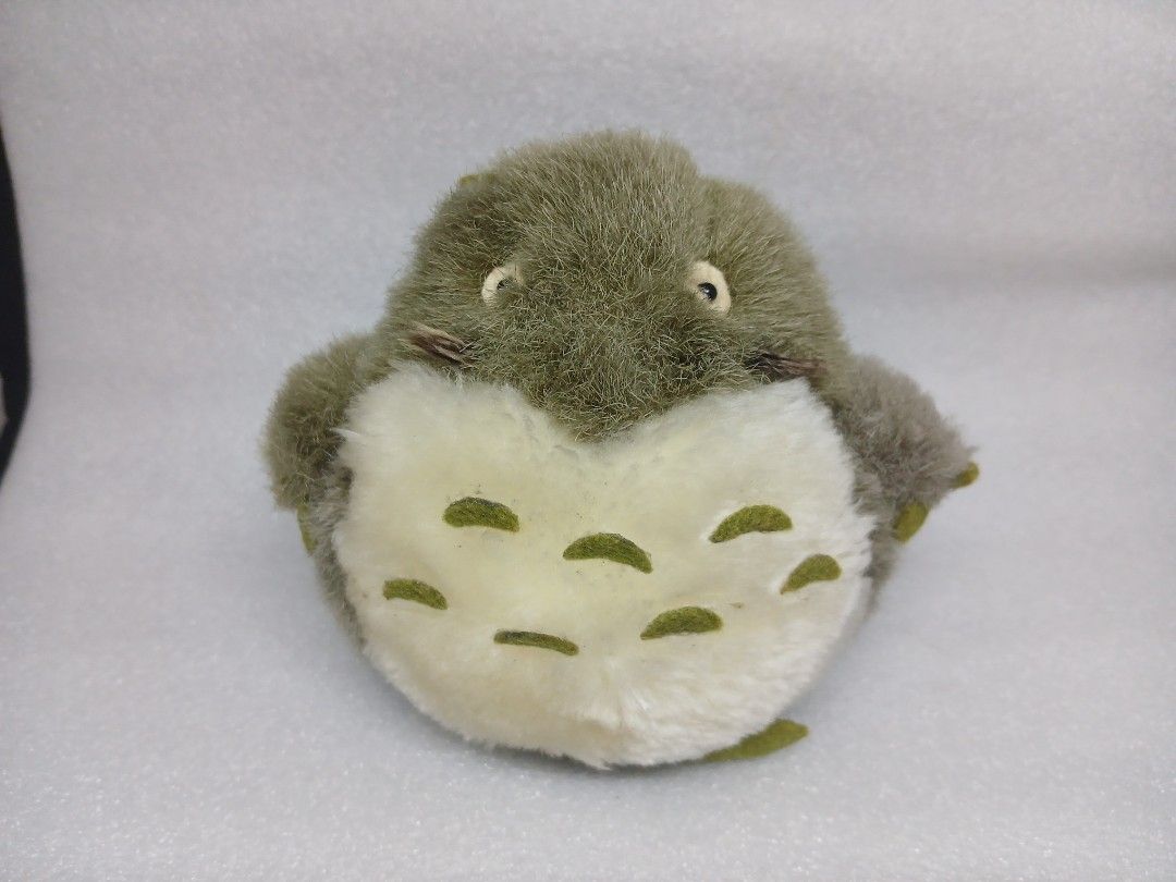 Studio Ghibli Totoro Green Leaf Plush Toy (Category: Plushies & Soft Toys) located in Pila. Submitted by Yela.ph_1 (Listing ID 1467946188, Image 2). Description: - Adorable green Totoro-inspired plush toy - Fluffy grey-green fur with a soft cream belly - Features cute green felt chest markings and a small leaf on the head - Designed with a soft round body, small limbs, and a fuzzy tail - Perfect collectible piece for Studio Ghibli fans - Conditio