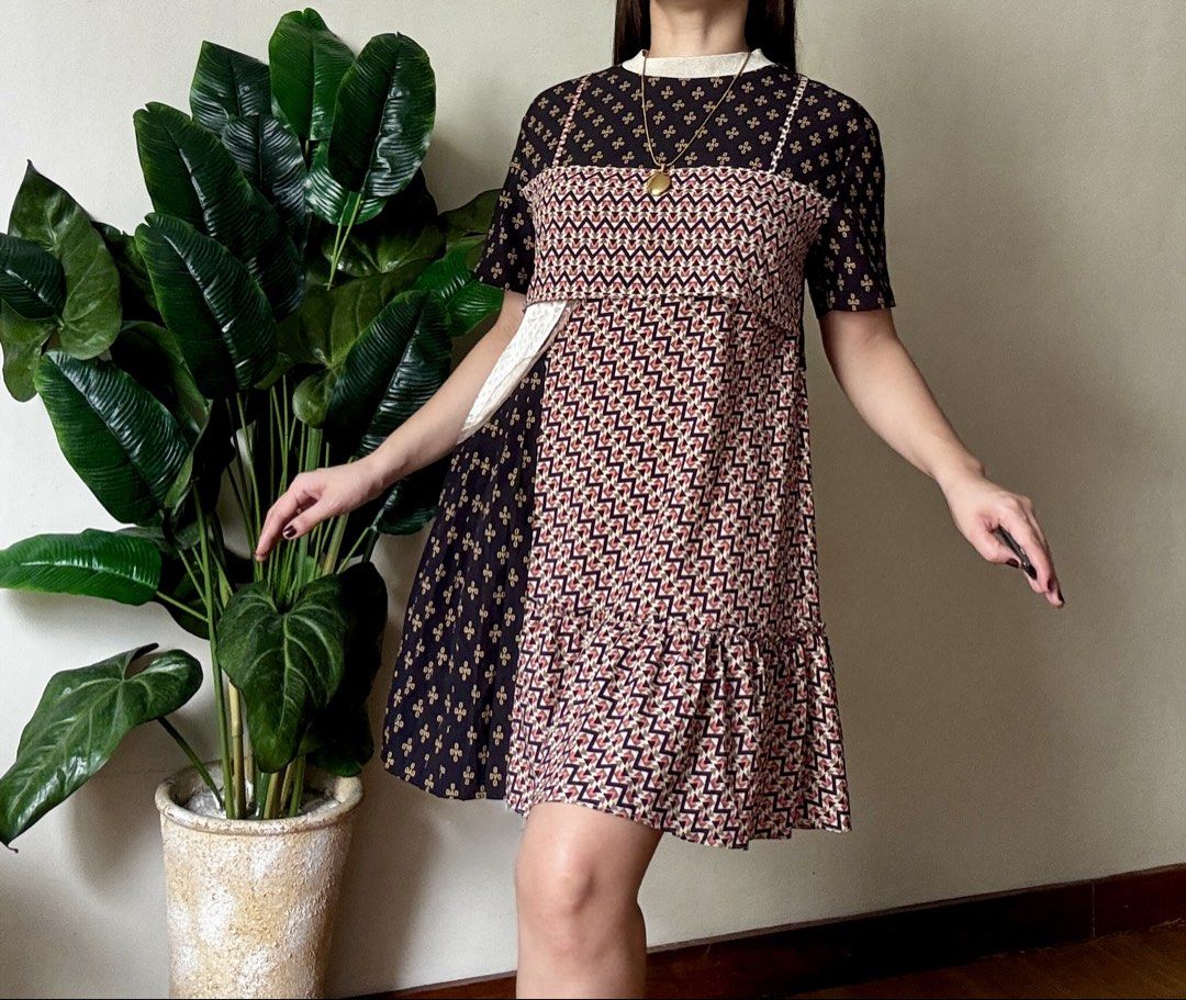 SUJIAN Unique Mixed Print Patchwork Cami Dress with Tee Layer,s to m (Category: Dresses) located in Mandaluyong City. Submitted by roxieeeeeee (Listing ID 1468037915, Image 2). Description: - Quirky mixed print mini dress with black floral and geometric zigzag patterns - Built-in short sleeve top layer under a cami-style bodice with lace trim - Features pleated panels and fun textured contrast pieces - Comfortable fit that falls above the knee - 