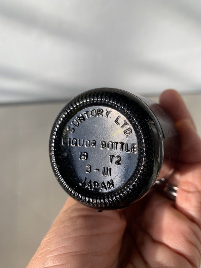 Suntory Reserve Whisky Miniature Bottle (Category: Vintage Collectibles) located in Taguig. Submitted by madisam (Listing ID 1467916927, Image 3). Description: - Item: Miniature Suntory Reserve Special Blend Japanese Whisky - Volume: 50ml - Design: Black glass body with elegant gold lettering and white screw cap - Authenticity: Bottom marked Suntory Ltd Liquor Bottle Japan - Condition: Perfect collector's piece for whisky enthusiasts.