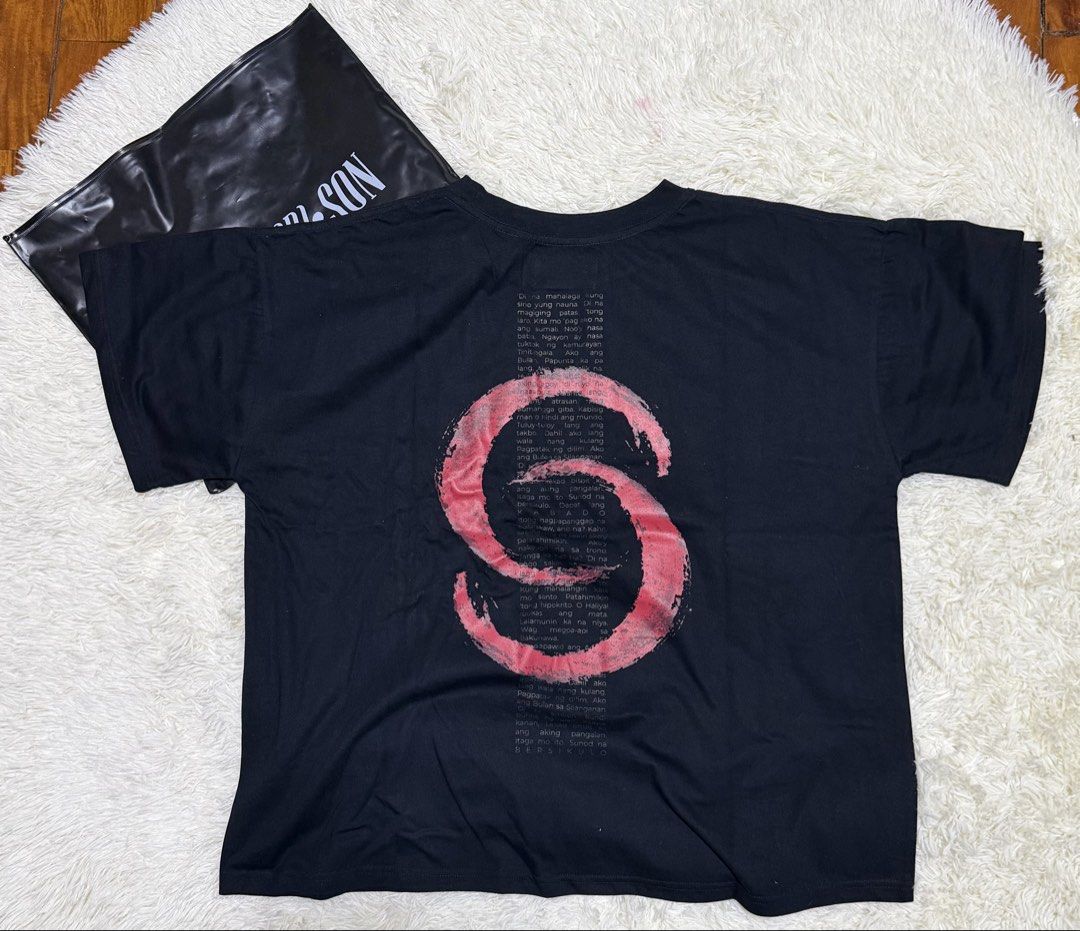 Superior Son Bulan shirt (Category: Tshirts & Polo Shirts ) located in Manila. Submitted by strbrrictoria (Listing ID 1467922098, Image 2). Description: - Brand: Superior Son - Color: Black - Design: White gothic text on chest, large red brushstroke 'S' with grey typography on the back - Fit: Short sleeves, standard crew neck - Inclusions: Comes with original black branded zip storage bag - Condition: Excellent / Well-maintained - Mode of Payment