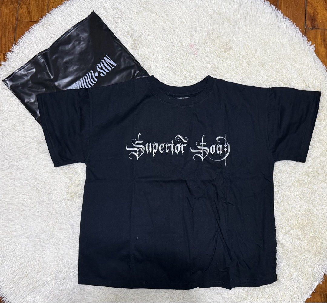 Superior Son Bulan shirt (Category: Tshirts & Polo Shirts ) located in Manila. Submitted by strbrrictoria (Listing ID 1467922098, Image 1). Description: - Brand: Superior Son - Color: Black - Design: White gothic text on chest, large red brushstroke 'S' with grey typography on the back - Fit: Short sleeves, standard crew neck - Inclusions: Comes with original black branded zip storage bag - Condition: Excellent / Well-maintained - Mode of Payment