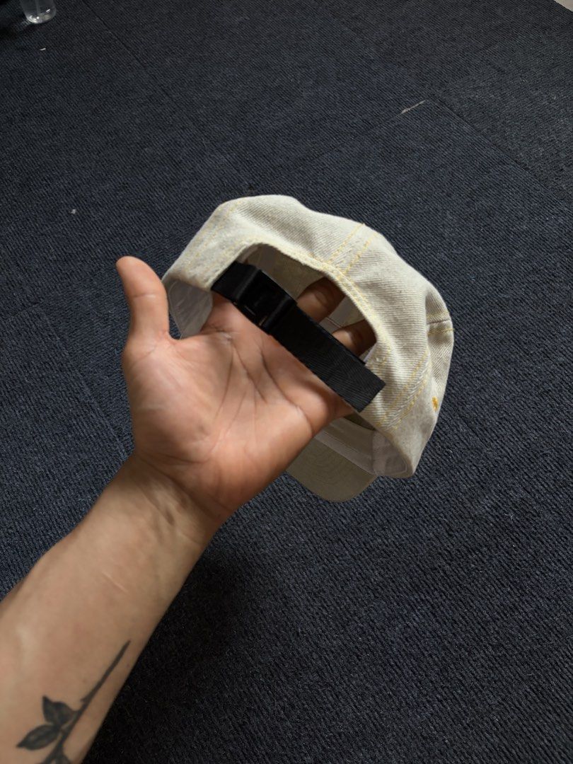 Supreme Box Logo Camp Cap Off White Cream Denim (Category: Caps & Hats) located in Manila. Submitted by toys_hats005 (Listing ID 1467955824, Image 2). Description: - Brand: Supreme - Style: Camp cap in off-white denim - Details: Contrast yellow stitching, black box logo patch on front - Closure: Adjustable black strap with black plastic buckle - Condition/Shape: Clean overall shape with white interior sweatband - Vibe: Essential streetwear staple