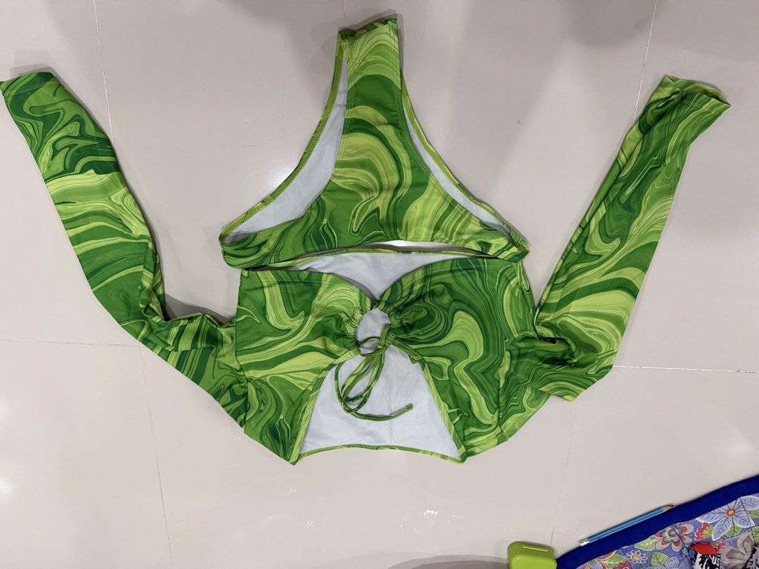 swimsuits (Category: Bikinis & Swimsuits) located in Quezon City. Submitted by jaypsg (Listing ID 1467978850, Image 3). Description: 90pesos each - Bundle of 5 different two-piece swimsuits - Includes blue swirl and green swirl long-sleeve crop top sets - Features pink/neon green, black & white zebra, and multicolored striped sets - Mix of styles: long sleeves, high-waisted bottoms, and classic straps - Perfect variety for beach trips, pool parti