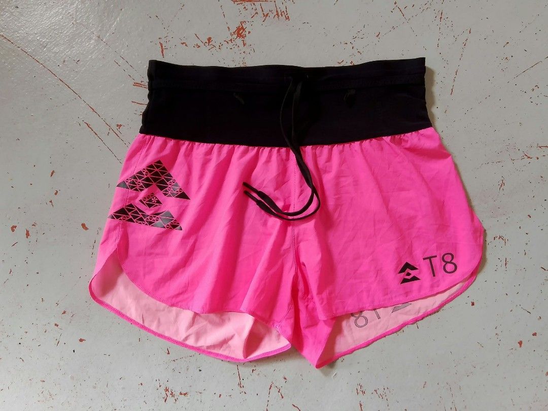 T8 Running Shorts Pink Black (Category: Activewear) located in Quezon City. Submitted by cruz_robert (Listing ID 1468011790, Image 1). Description: - Brand/Model: T8 Running Shorts - Color: Bright pink with black waistband - Fit & Comfort: Ultra-lightweight fabric with internal adjustable drawstring - Design: Geometric pattern on the left leg and printed brand logo on the right - Condition: Excellent, no damage seen - Ideal For: Running, workouts