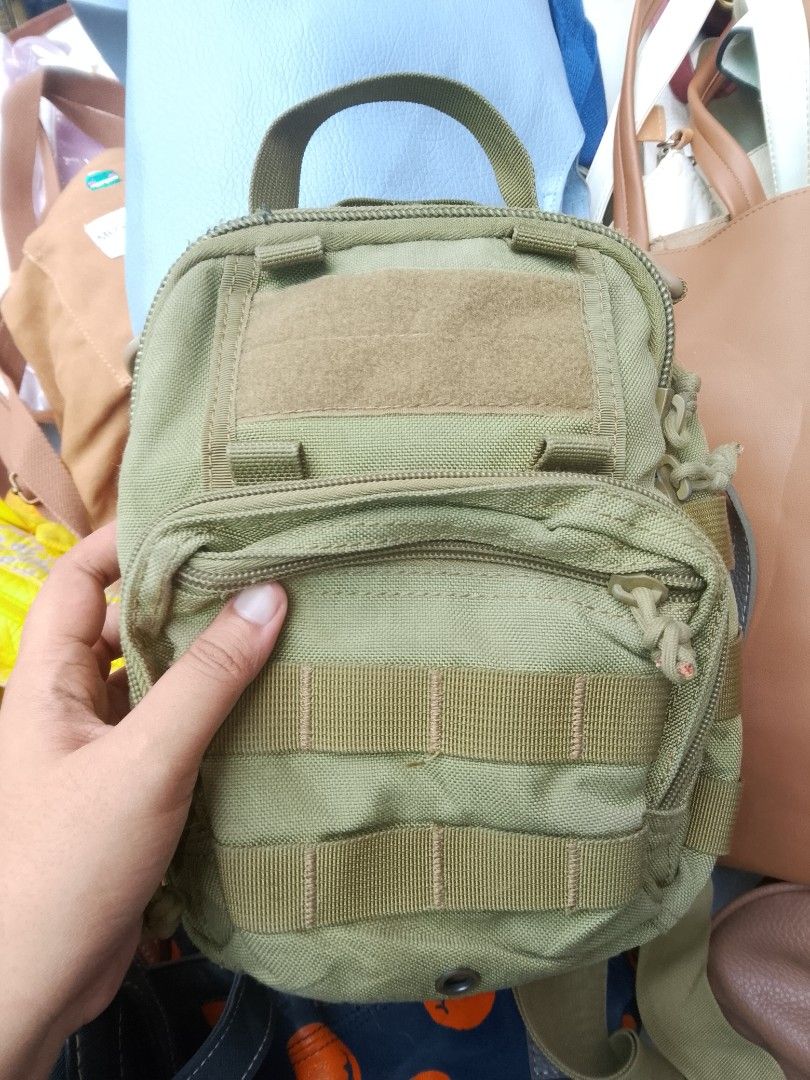 TACTICAL BAG (Category: Sling Bags) located in Naga. Submitted by choythrift (Listing ID 1467856029, Image 1). Description: For her/him 👧🏻🧒🏻 TACTICAL BAG 9/10 excellent condition 9/10 color rate Plus shipping fee Courier: J and t, flash express Drop off: Urban Chicc Location: Naga City, Bicol📍 📩.